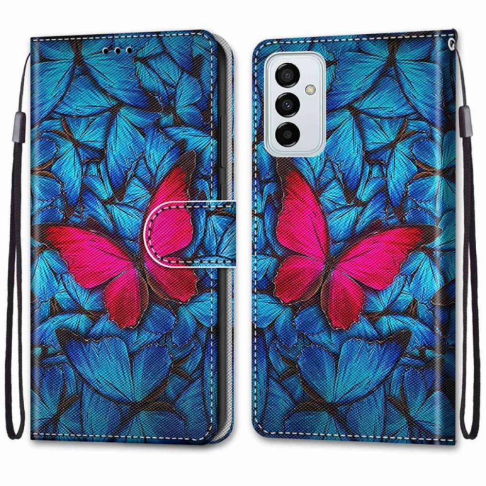 Flip Case Für Samsung Galaxy M23 5G Roter Schmetterling Auf Blauem Hintergrund