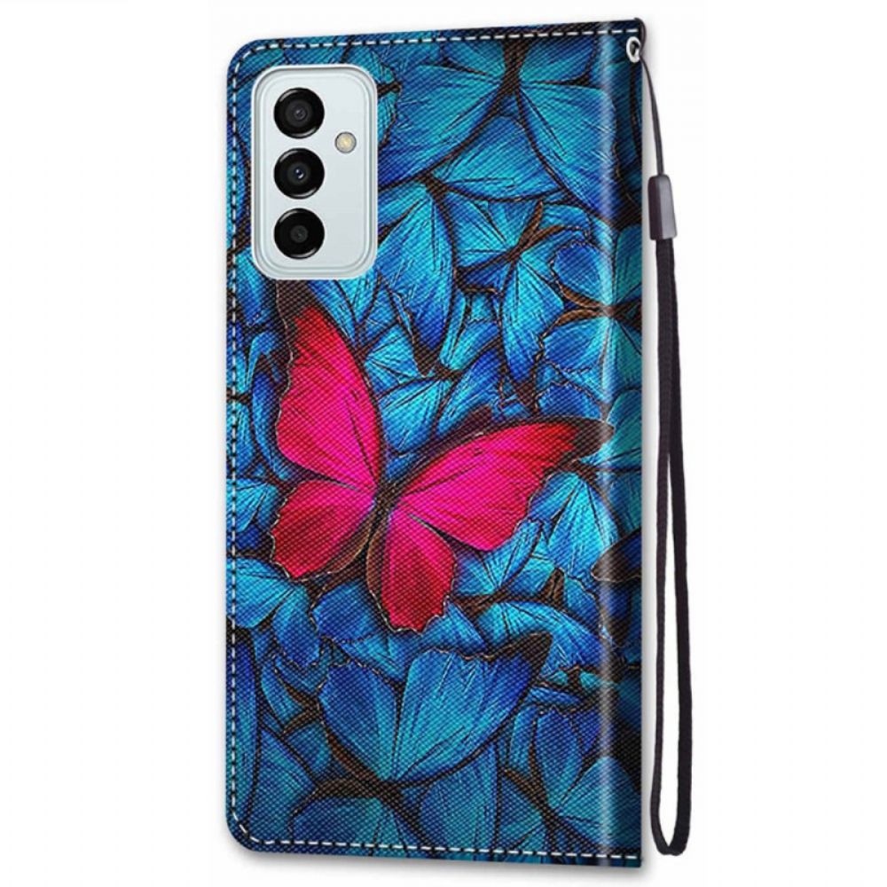 Flip Case Für Samsung Galaxy M23 5G Roter Schmetterling Auf Blauem Hintergrund