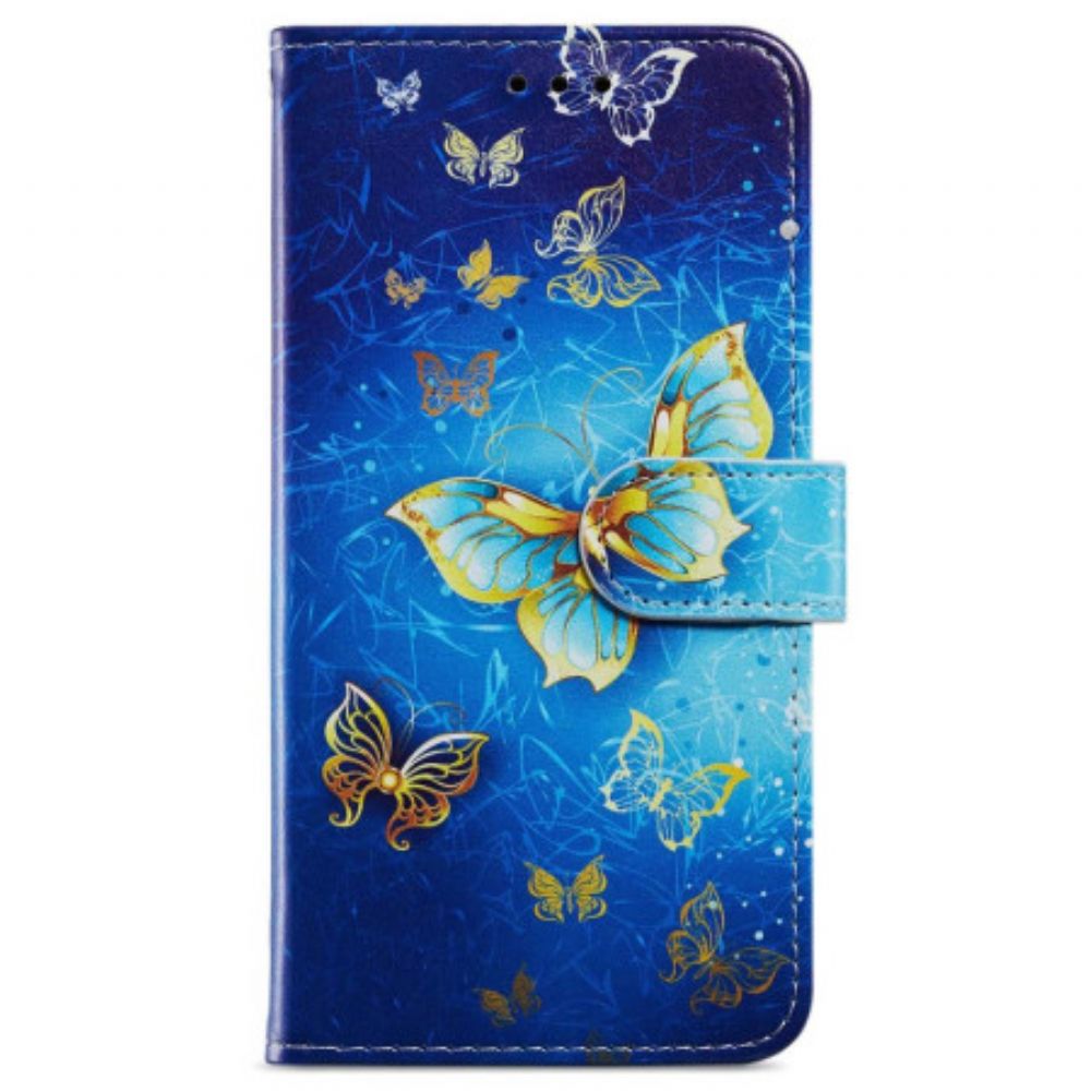 Lederhüllen Samsung Galaxy A55 5g Goldener Schmetterling Auf Blauem Hintergrund Mit Riemen