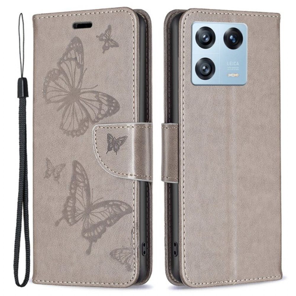 Flip Case Für Xiaomi 13 Pro Mit Kordel Riemchen Mit Schmetterlingen-print